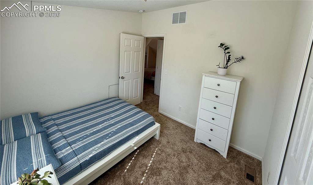 61 Stripling Lane Divide, CO 80814 - Photo 23 of 47 a bedroom with a bed and a dresser