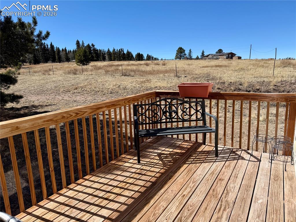 61 Stripling Lane Divide, CO 80814 - Photo 33 of 47 a view of a balcony with wooden floor and fence
