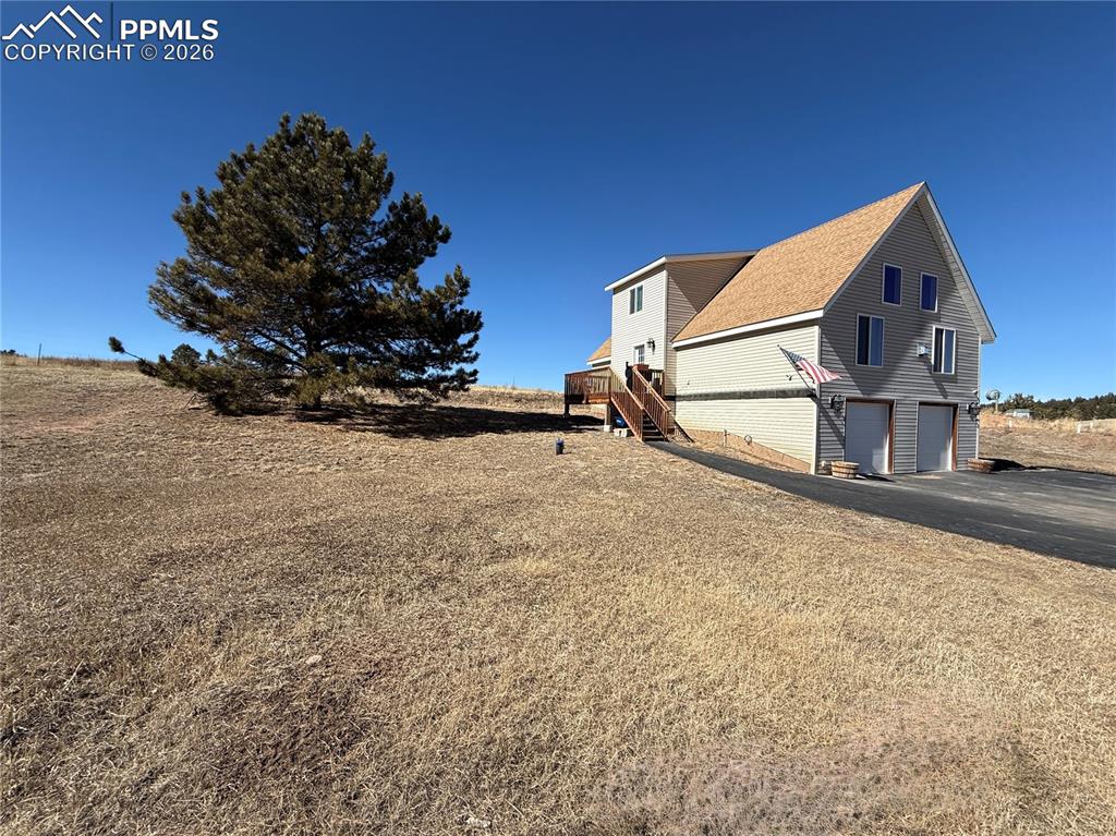 61 Stripling Lane Divide, CO 80814 - Photo 34 of 47 a view of a house with a yard