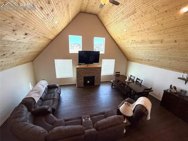 a living room with furniture or fireplace and a wooden floor