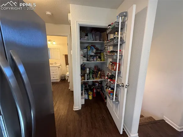 a kitchen with a stove a sink and a refrigerator