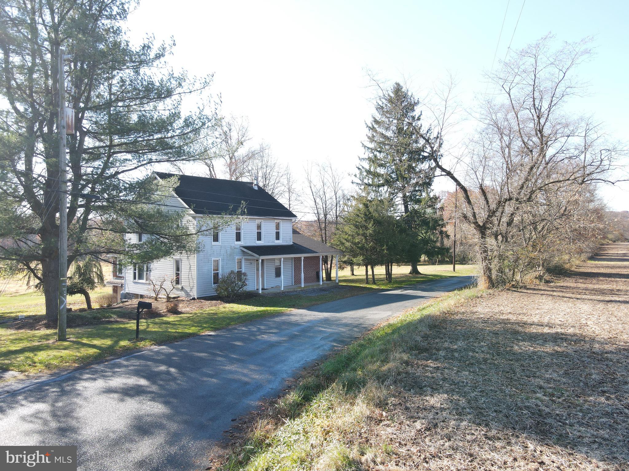 230 South Hertzler Road Elizabethtown, PA 17022 - Photo 5 of 78 a front view of a house with a yard and lake view