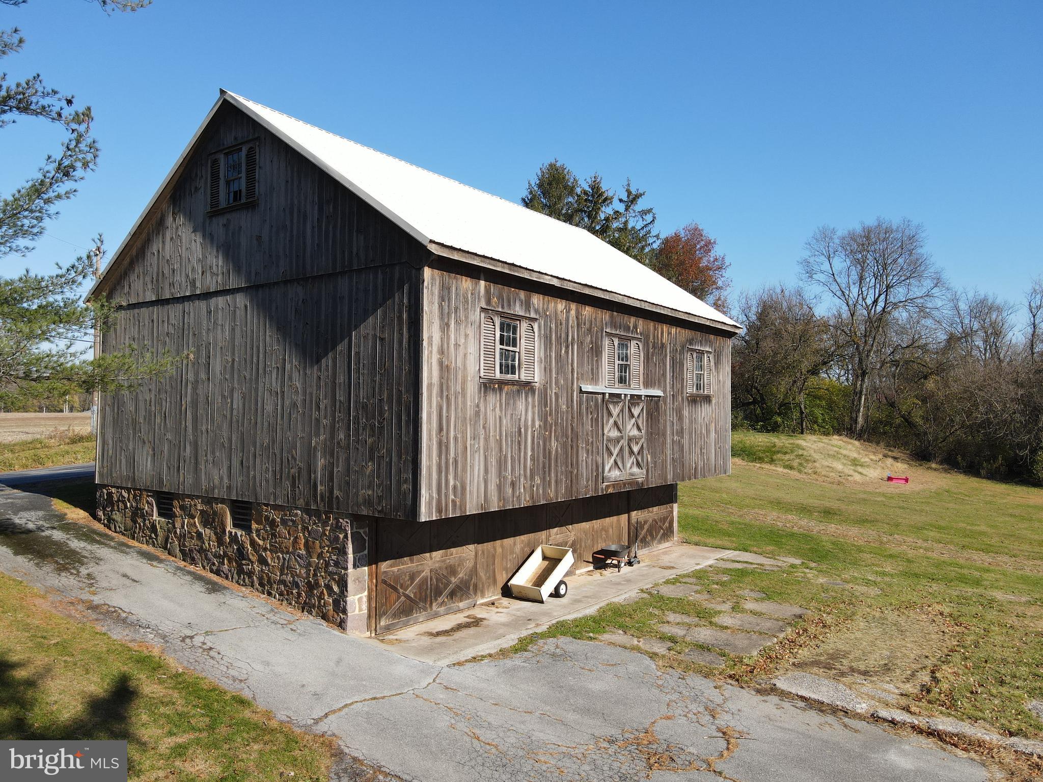 230 South Hertzler Road Elizabethtown, PA 17022 - Photo 55 of 78 a street view with wooden fence and a bench
