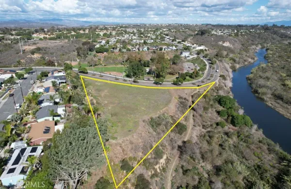 an aerial view of a residential houses with outdoor space
