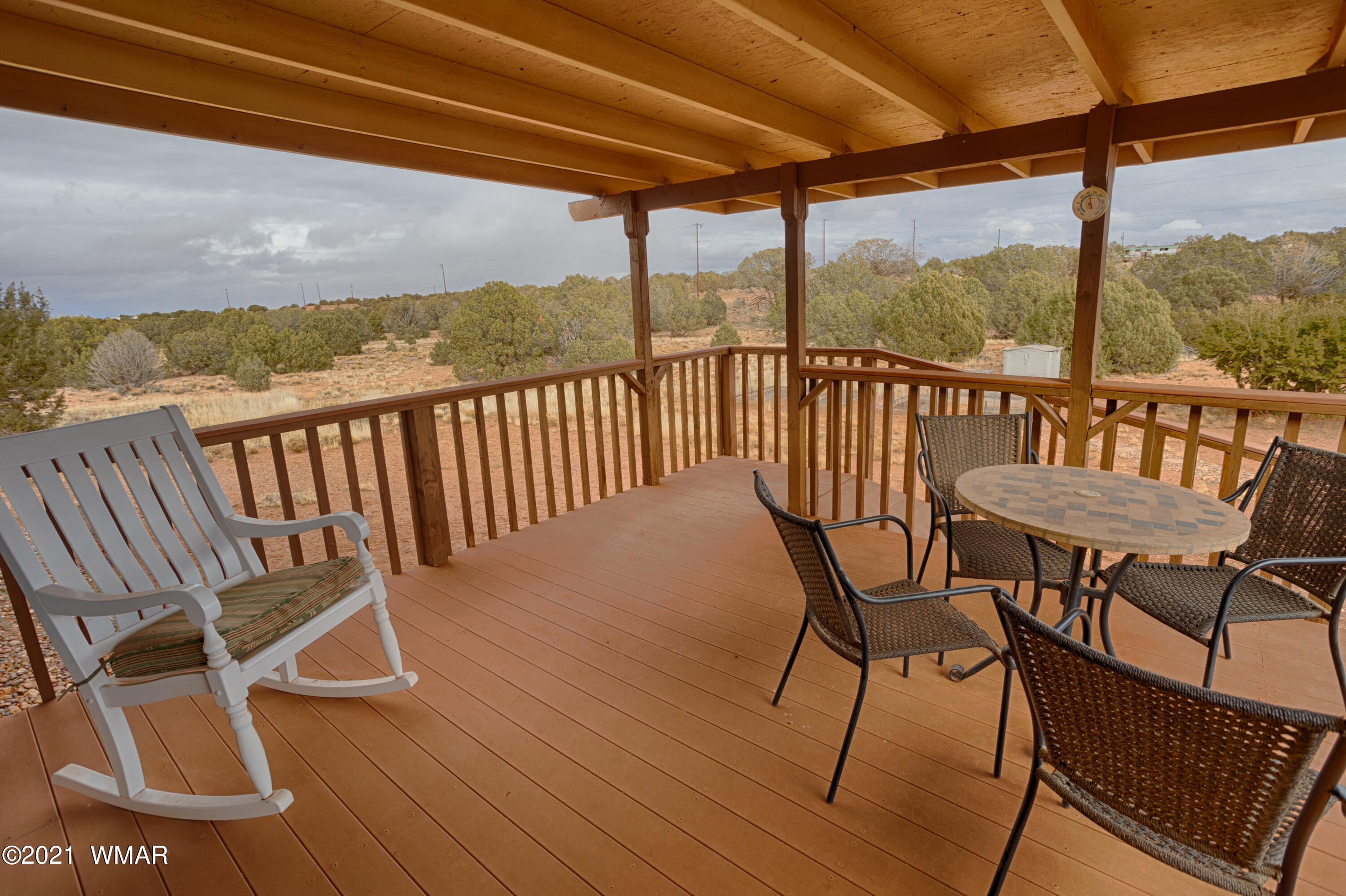 4464 Clydesdale Road Snowflake, AZ 85937 - Photo 1 of 30 a view of a chairs and table on the deck