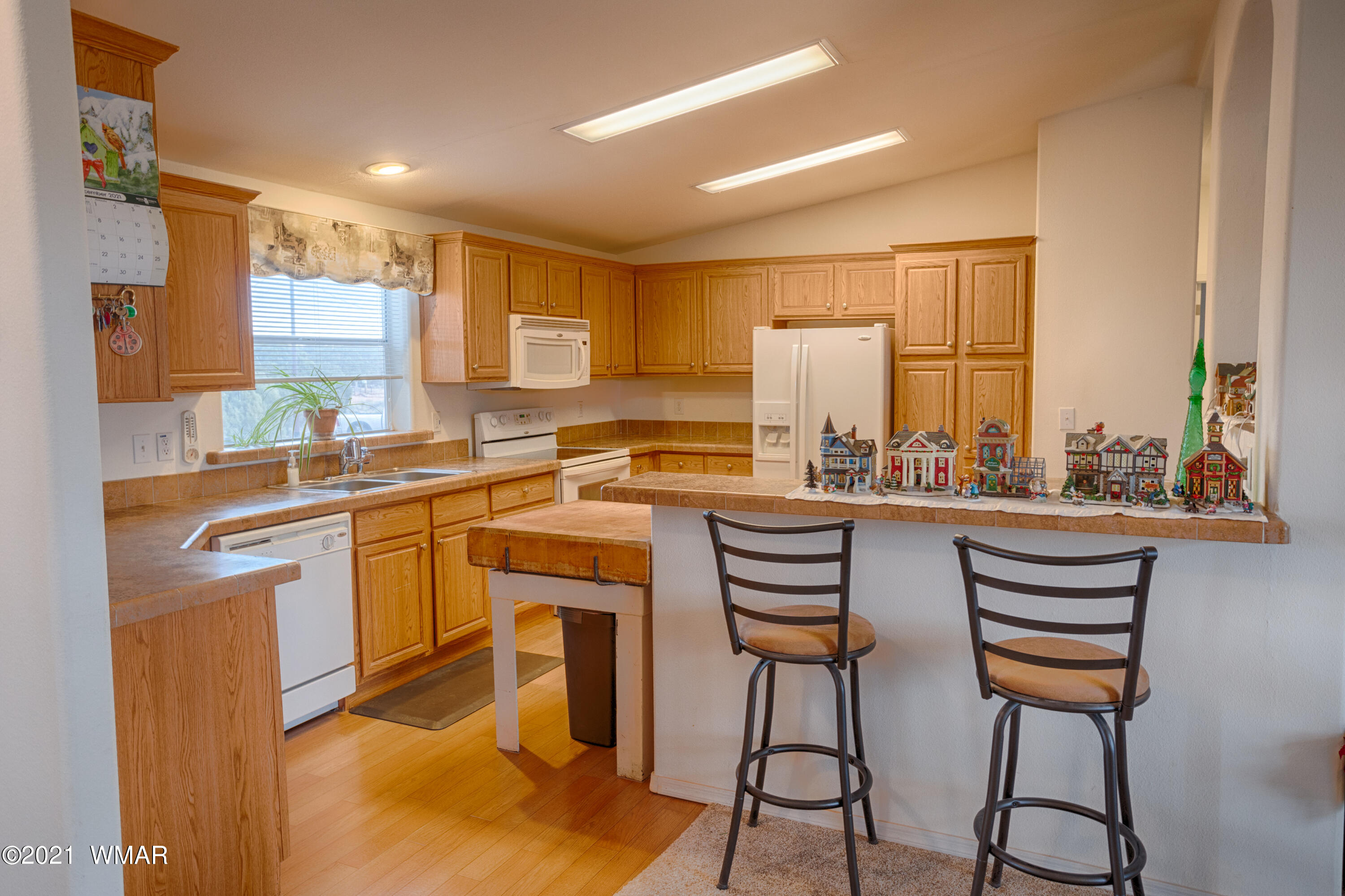 4464 Clydesdale Road Snowflake, AZ 85937 - Photo 11 of 30 a kitchen with a sink cabinets and window