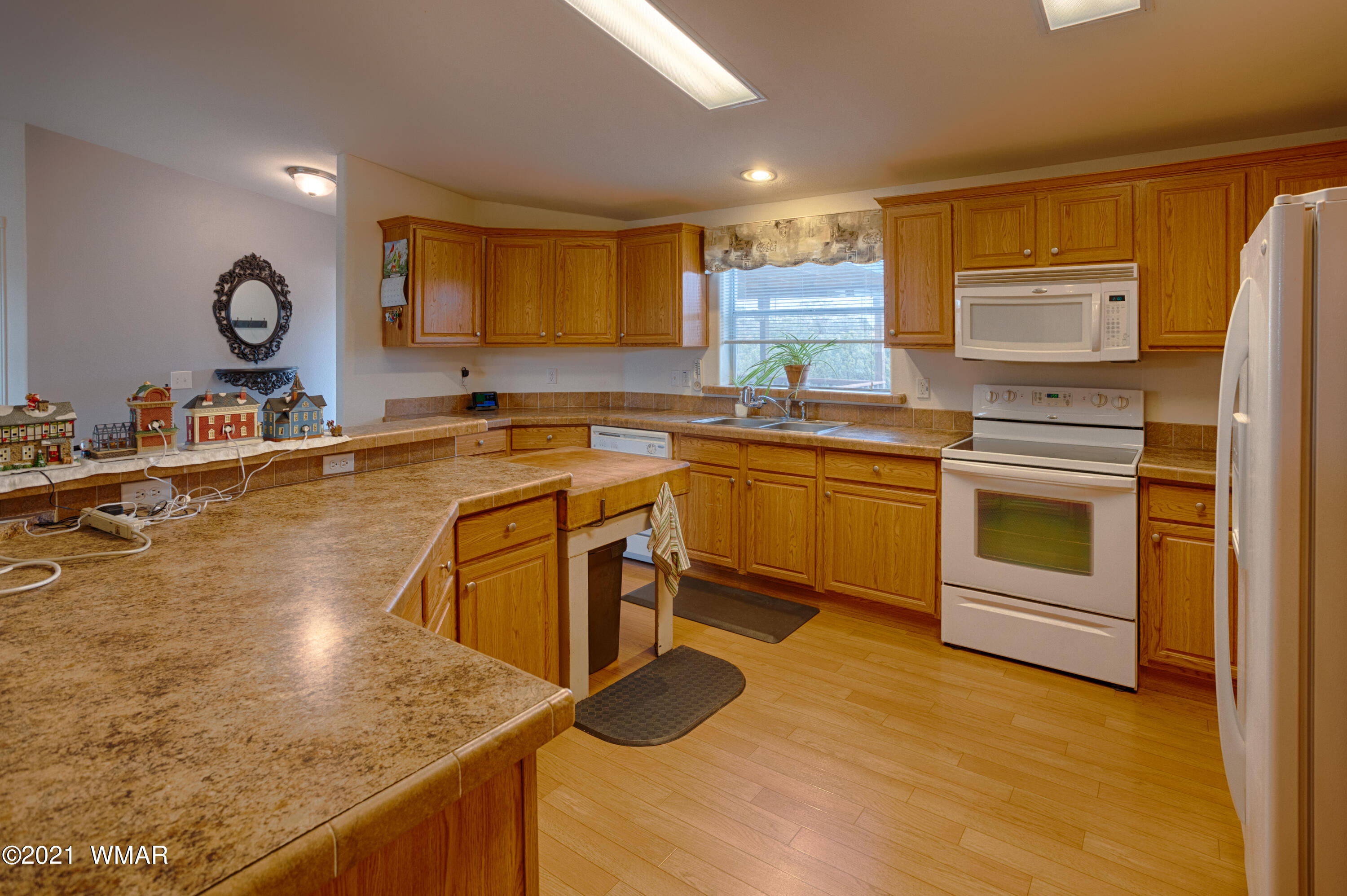 4464 Clydesdale Road Snowflake, AZ 85937 - Photo 12 of 30 a kitchen with a sink stove and cabinets