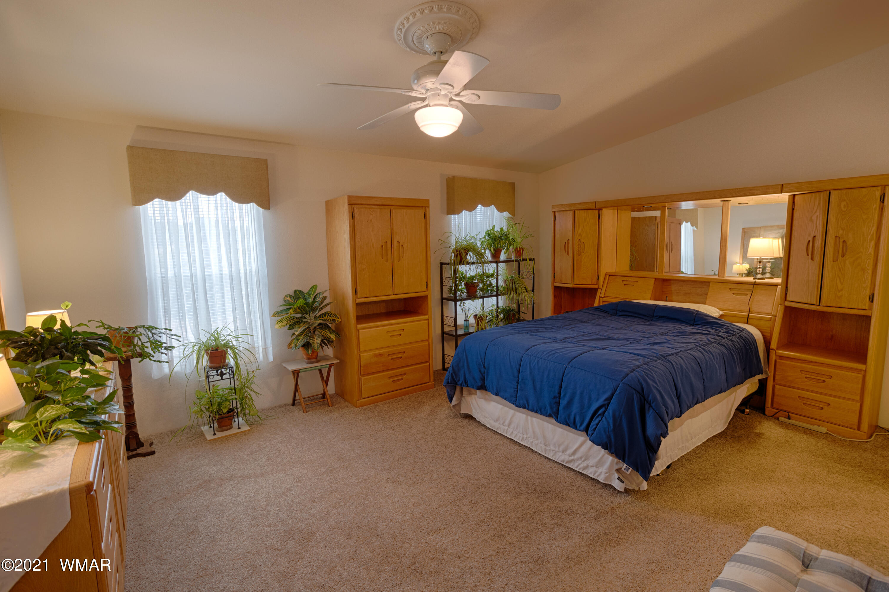 4464 Clydesdale Road Snowflake, AZ 85937 - Photo 15 of 30 a spacious bedroom with a bed and large windows