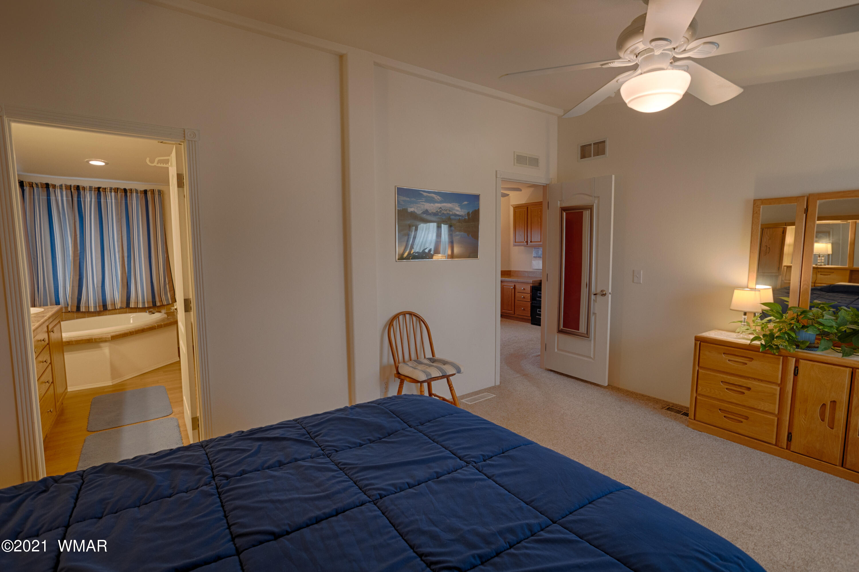 4464 Clydesdale Road Snowflake, AZ 85937 - Photo 16 of 30 a bedroom with a bed and a dresser in it