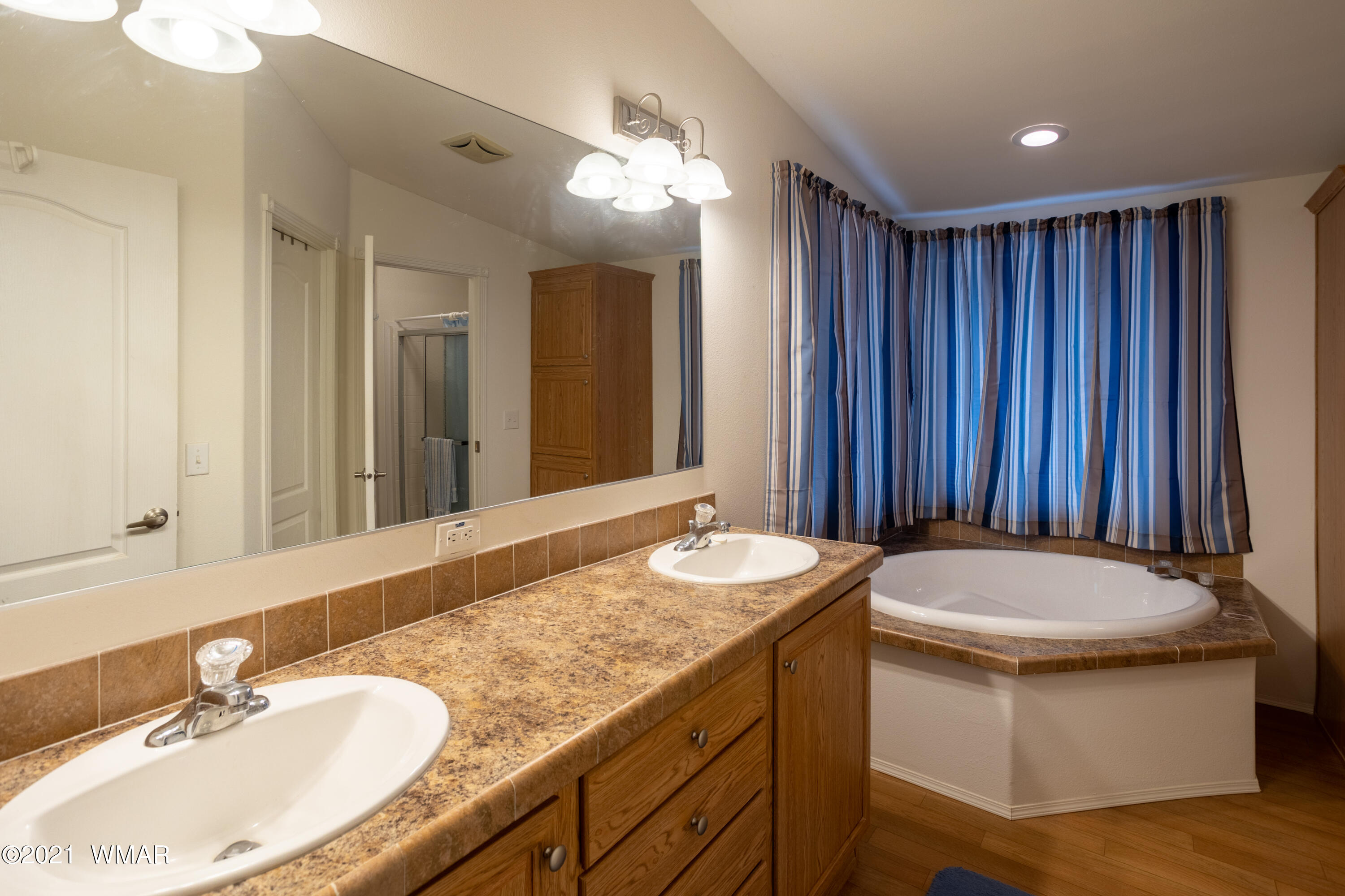 4464 Clydesdale Road Snowflake, AZ 85937 - Photo 17 of 30 a bathroom with a granite countertop sink and a mirror