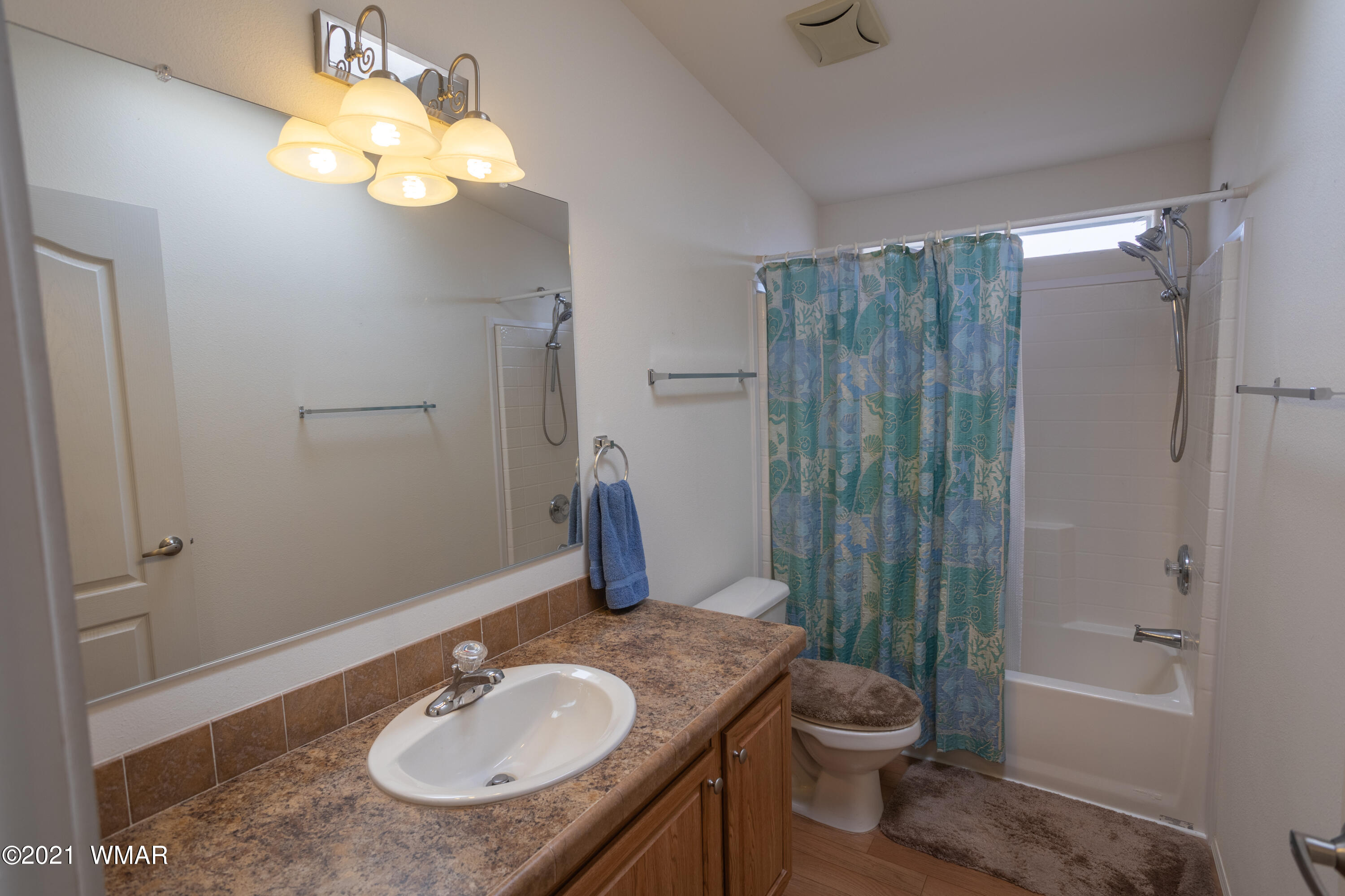 4464 Clydesdale Road Snowflake, AZ 85937 - Photo 22 of 30 a bathroom with a granite countertop sink toilet and shower