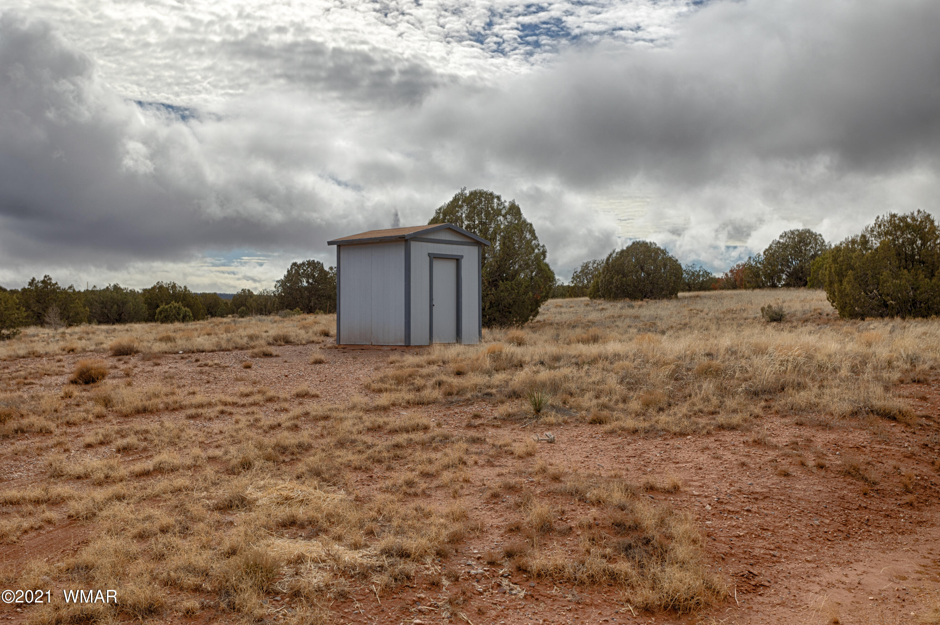 4464 Clydesdale Road Snowflake, AZ 85937 - Photo 25 of 30 a view of a dry yard with wooden fence