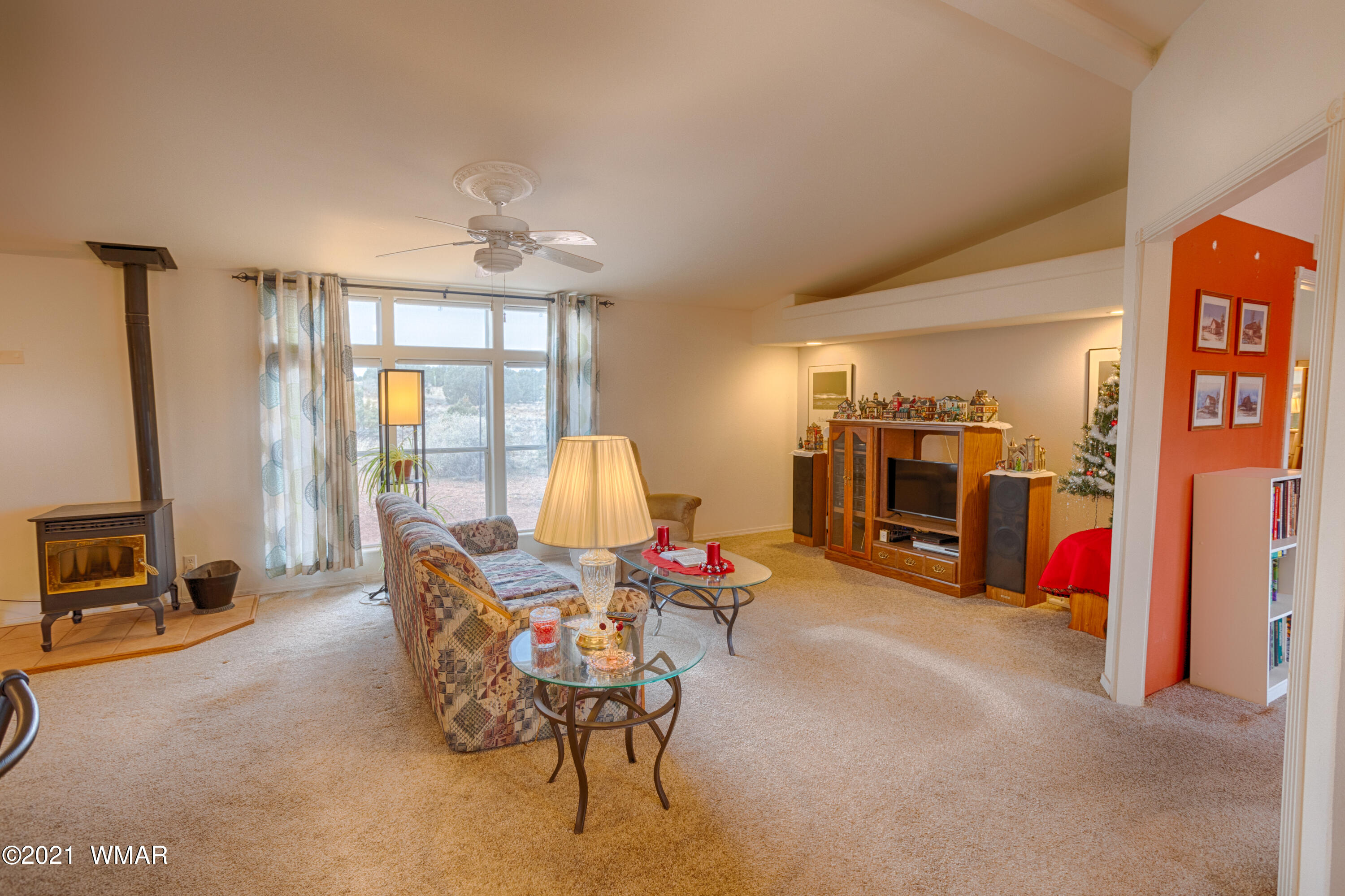 4464 Clydesdale Road Snowflake, AZ 85937 - Photo 5 of 30 a living room with furniture a flat screen tv and a large window