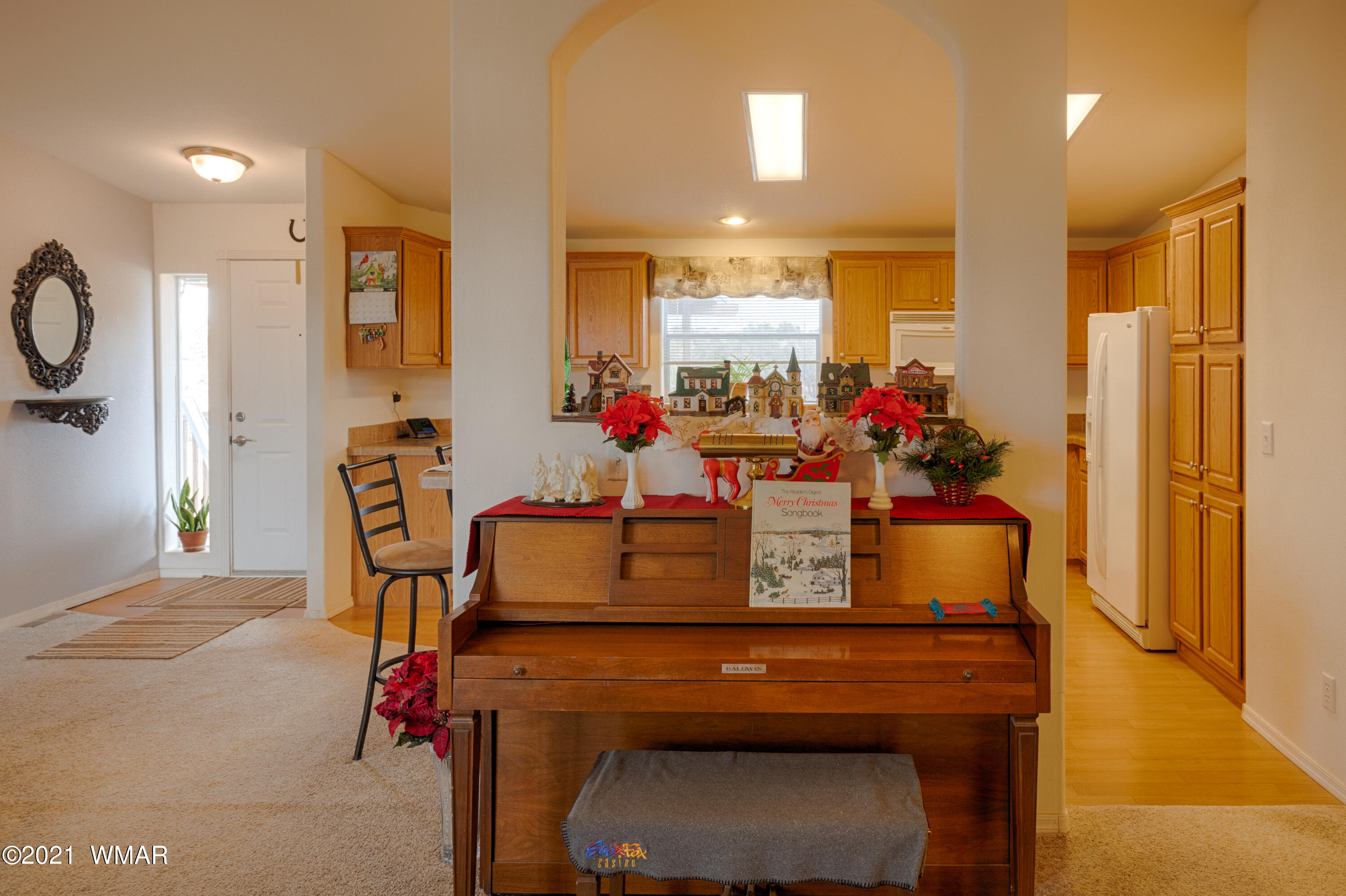 4464 Clydesdale Road Snowflake, AZ 85937 - Photo 10 of 30 a view of a dining room with furniture and a chandelier