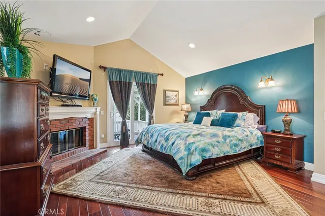 a bathroom with a sink a mirror a glass door and shower