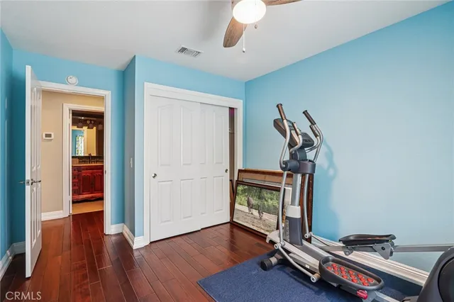 a living room with furniture a table and a lamp