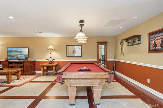 a view of a patio with couches table and chairs and potted plants