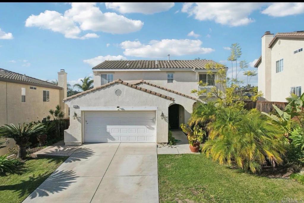 1234 Old Janal Ranch Road Chula Vista, CA 91915 - Photo 2 of 34 a front view of a house with a garden