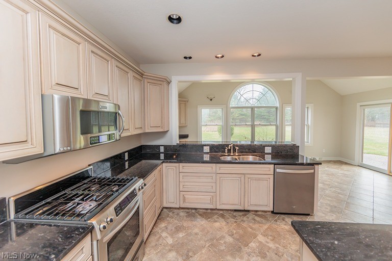 6947 Som Center Road Solon, OH 44139 - Photo 34 of 50 Kitchen with appliances with stainless steel finishes, light tile floors, plenty of natural light, and sink