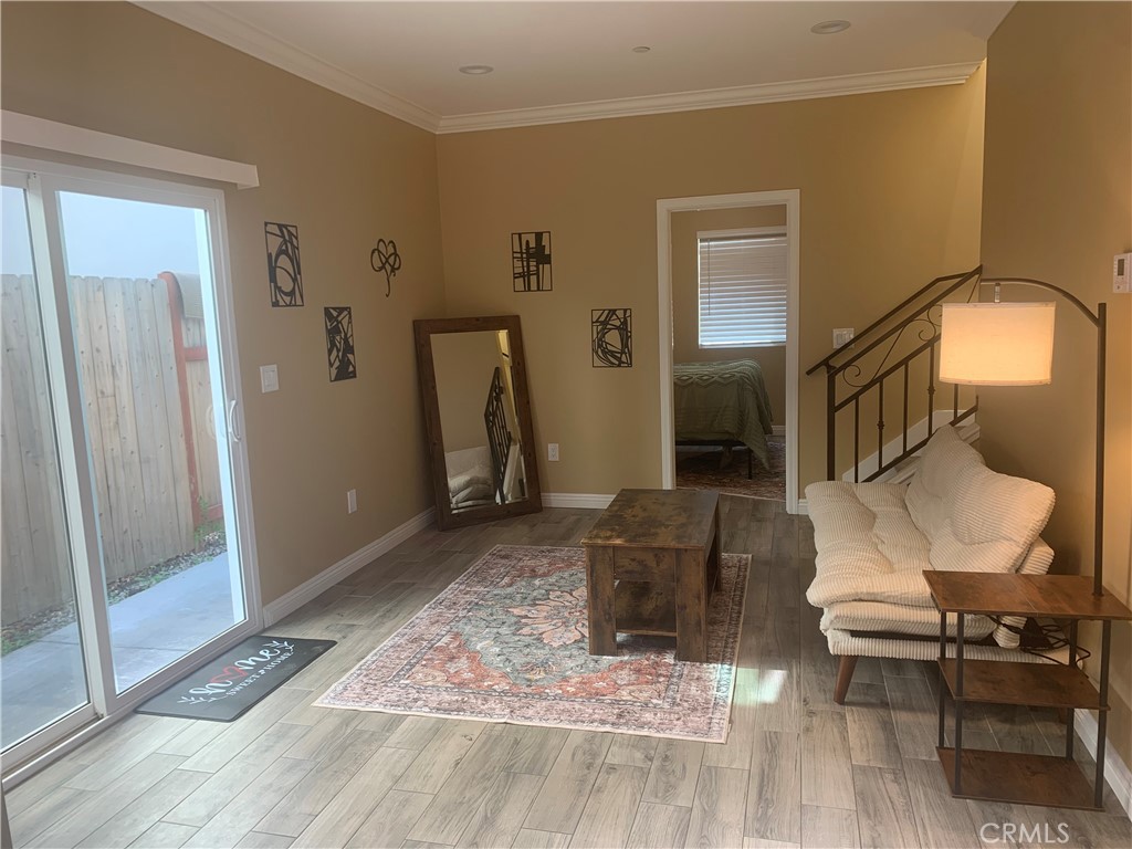 a living room with furniture and a rug