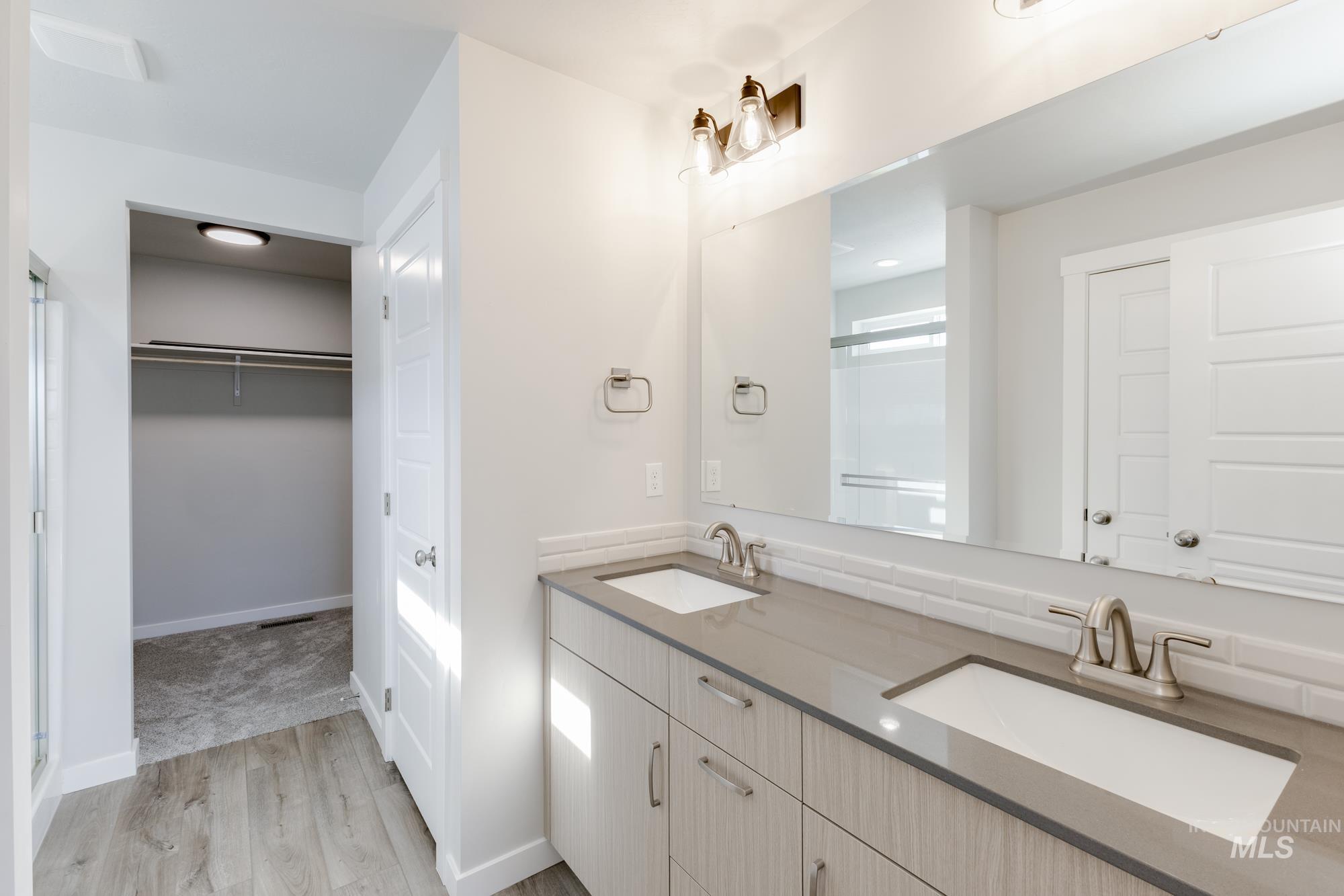 12853 Decatur Street Nampa, ID 83651 - Photo 23 of 24 Double vanity with integrated sinks and gray countertops