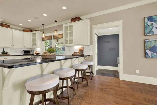 a bathroom with a toilet a sink and a mirror