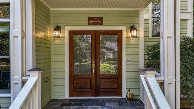 a view of a brick house with a glass door