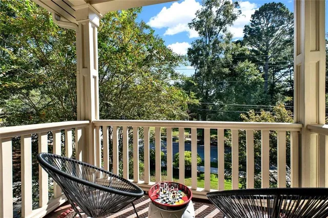 a bathroom with a white bath tub and a toilet