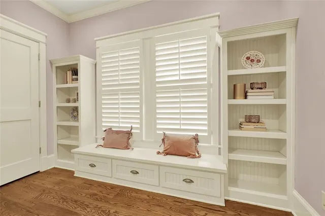 a bedroom with a bed and a mirror