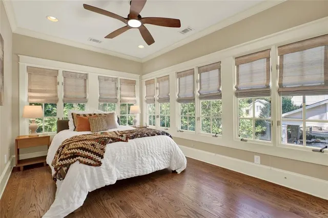 a view of a wooden deck and a backyard