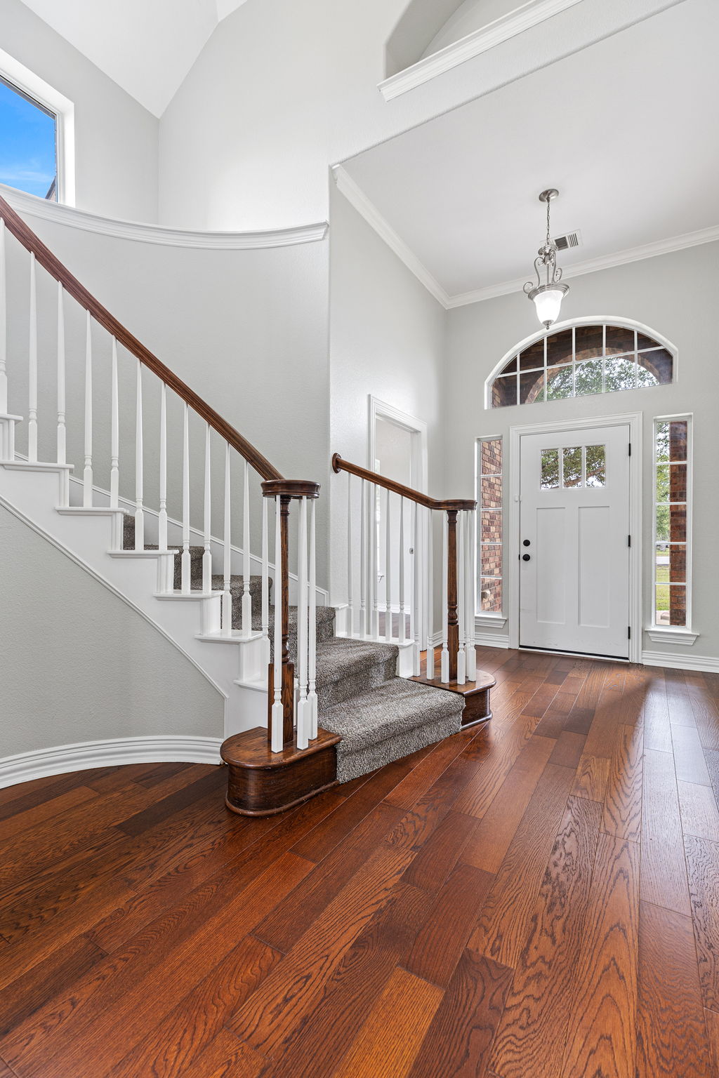 237 Cardinal Drive Paige, TX 78659 - Photo 4 of 37 Entrance foyer featuring a high ceiling and dark wood-style flooring
