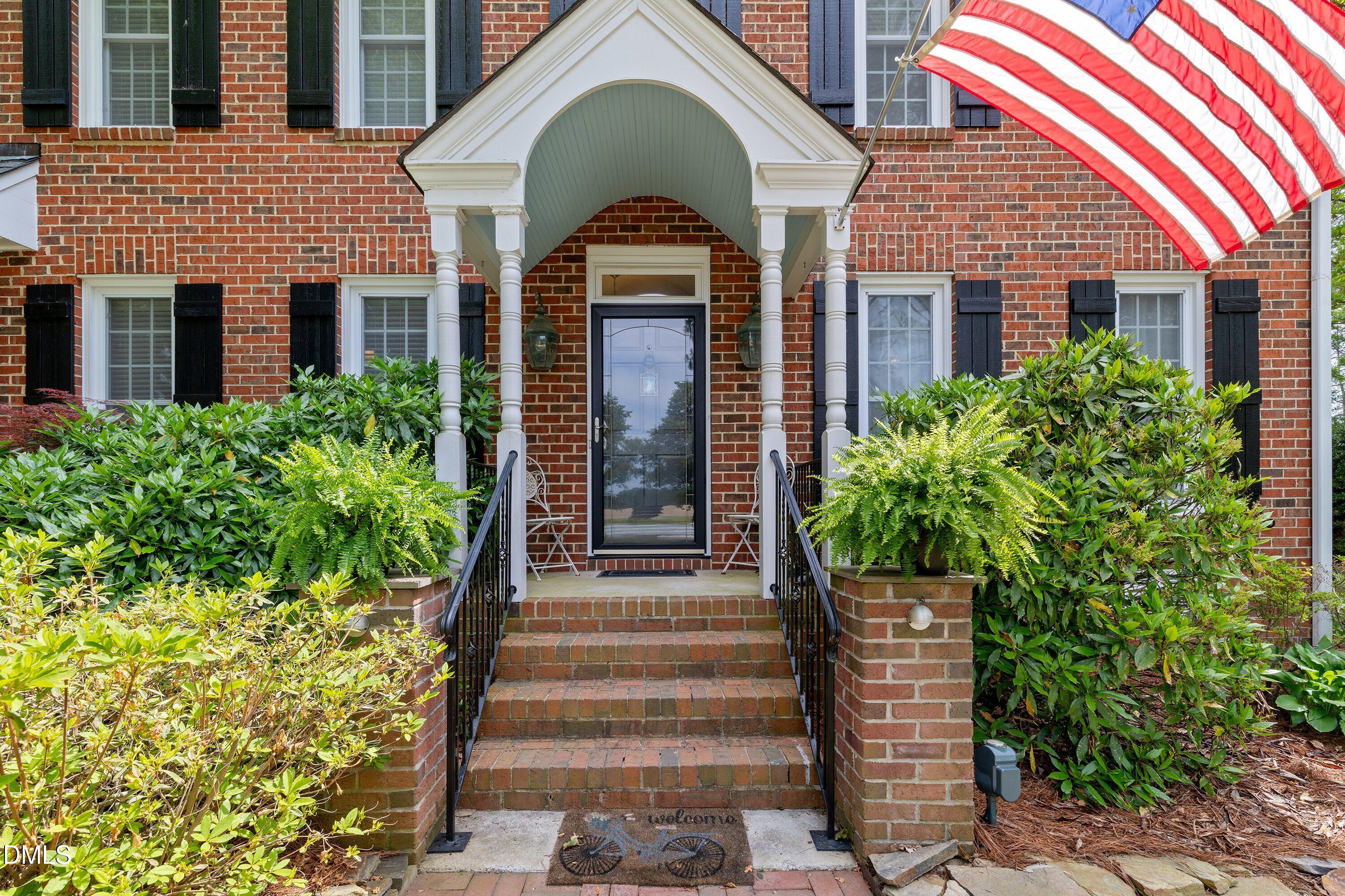 6612 Fowler Road Zebulon, NC 27597 - Photo 7 of 42 a front view of a house with a garden
