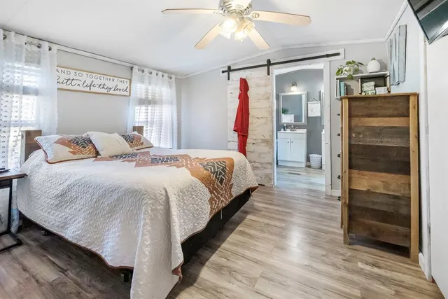 a bedroom with a bed and a walk in closet