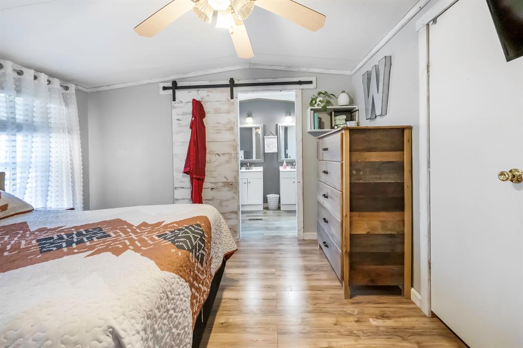 352 Jennifer Lane Eddy, TX 76524 - Photo 14 of 34 a bedroom with a bed and a window