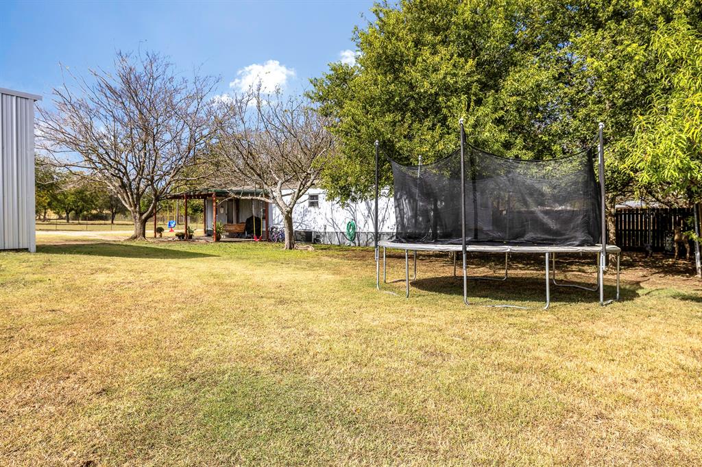 352 Jennifer Lane Eddy, TX 76524 - Photo 26 of 34 a view of a swimming pool with an outdoor space and seating area