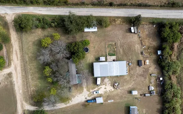 an aerial view of a house with a lake view