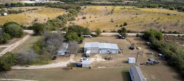 an aerial view of residential house with outdoor space