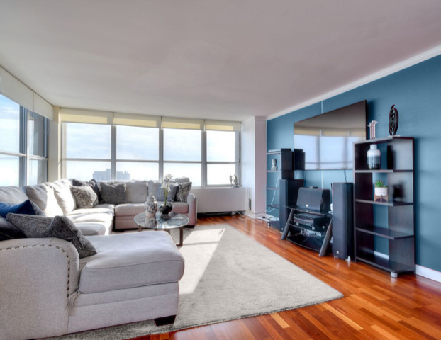 655 West Irving Park Road, Unit 4901 Chicago, IL 60613 - Photo 3 of 16 a living room with furniture and a window