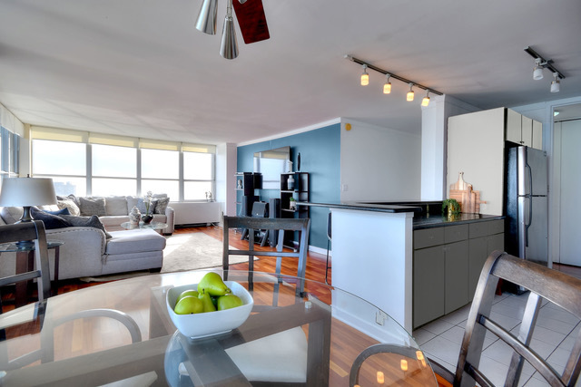 655 West Irving Park Road, Unit 4901 Chicago, IL 60613 - Photo 5 of 16 a living room with furniture and a window