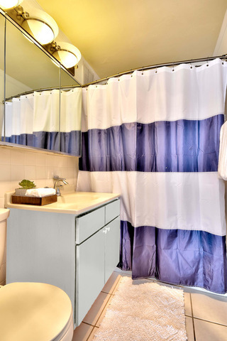 655 West Irving Park Road, Unit 4901 Chicago, IL 60613 - Photo 10 of 16 a bathroom with a sink and a mirror