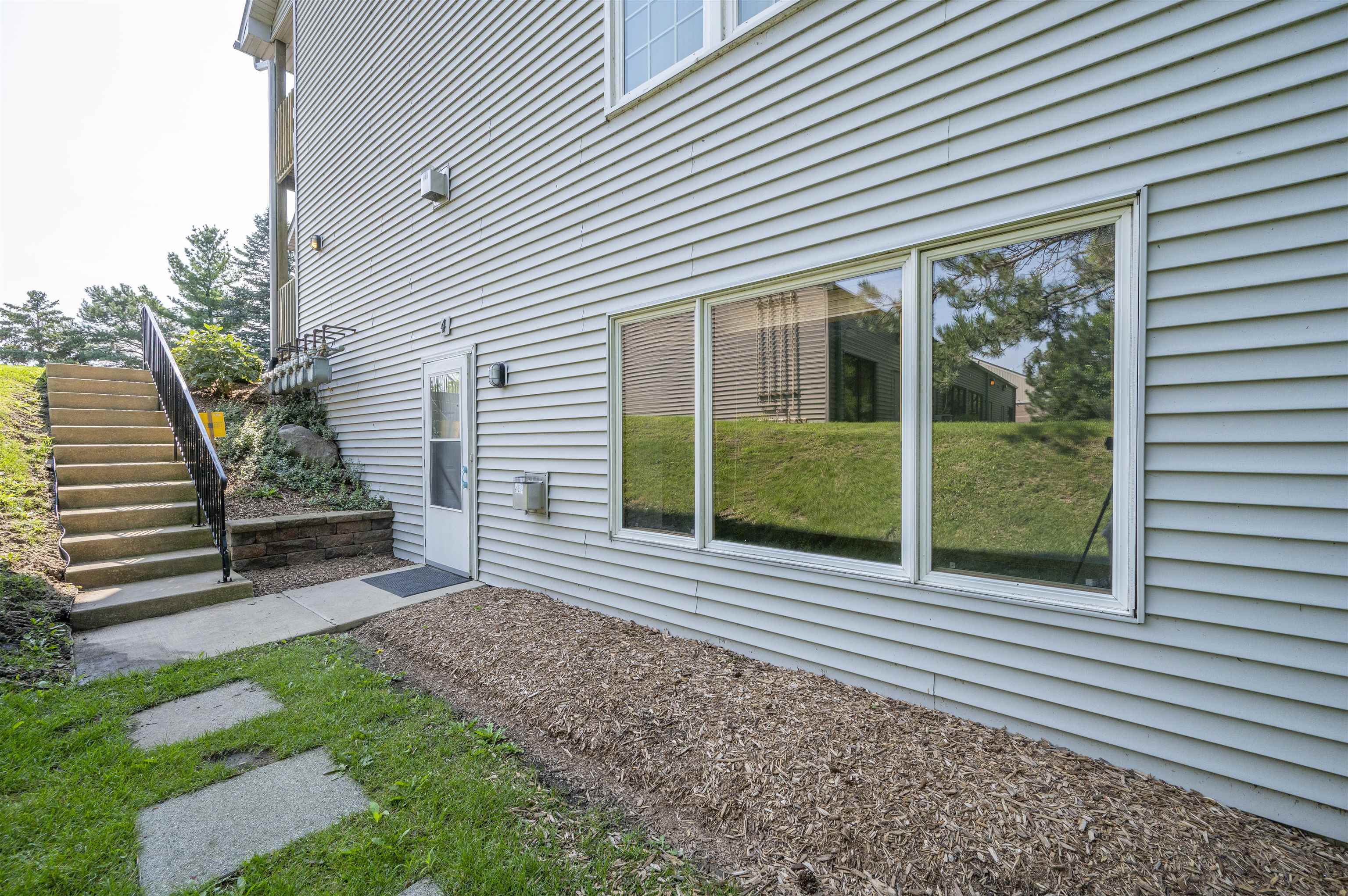7280 North Alpine Road Loves Park, IL 61111 - Photo 3 of 17 a view of a house with a yard and plants
