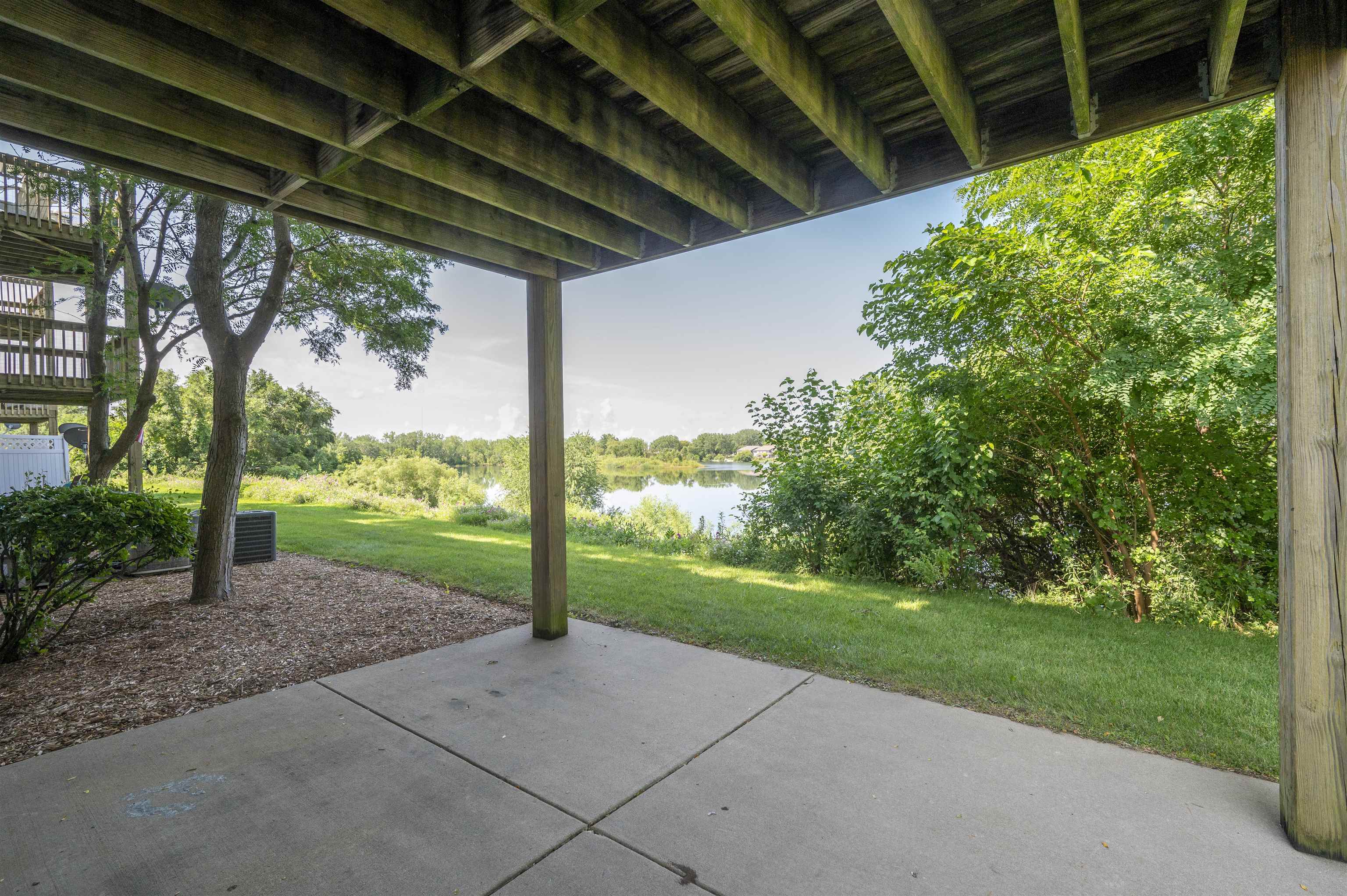 7280 North Alpine Road Loves Park, IL 61111 - Photo 5 of 17 a view of a backyard with porch