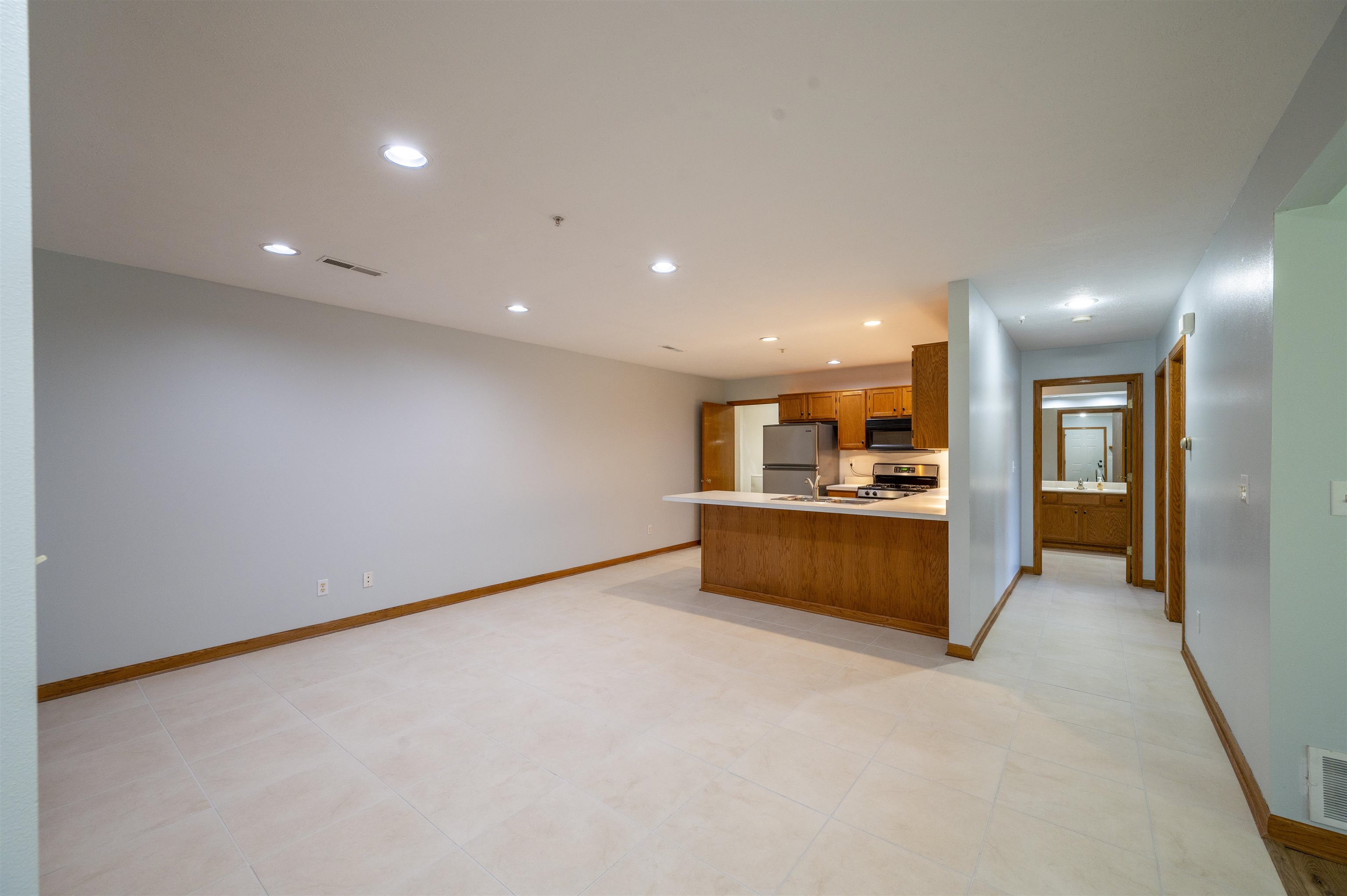 7280 North Alpine Road Loves Park, IL 61111 - Photo 9 of 17 a view of an empty room with kitchen