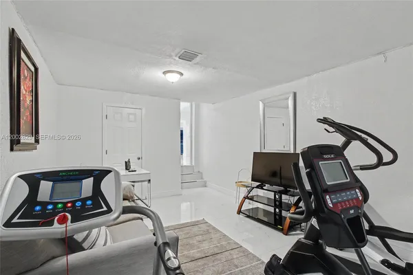 a view of a room with gym equipment