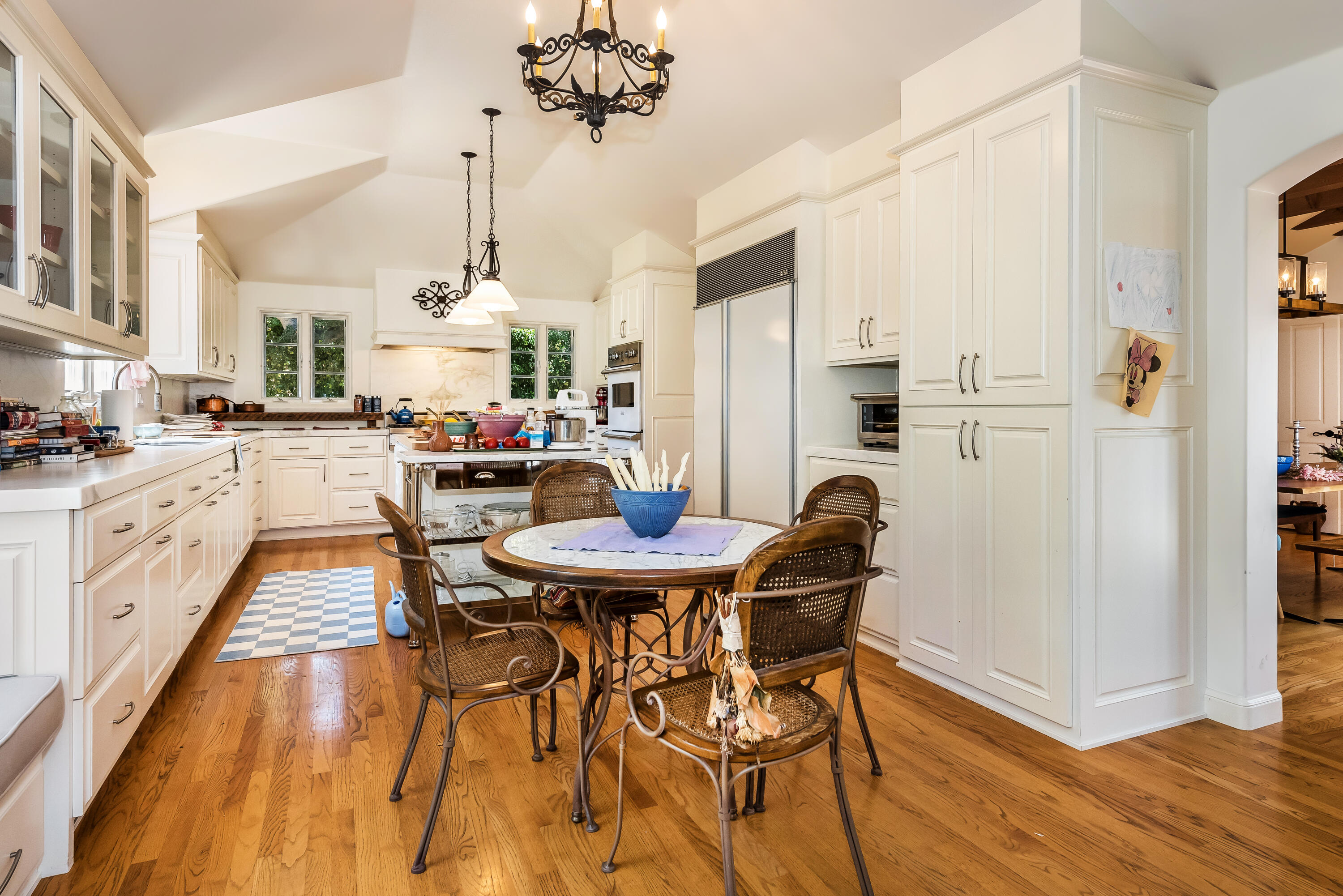 1394 School House Road Santa Barbara, CA 93108 - Photo 9 of 13 a dining room with furniture a chandelier and wooden floor