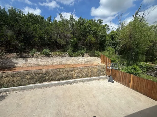 a view of backyard and tree