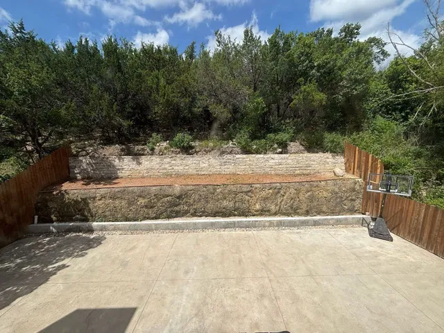 a view of a backyard of the house