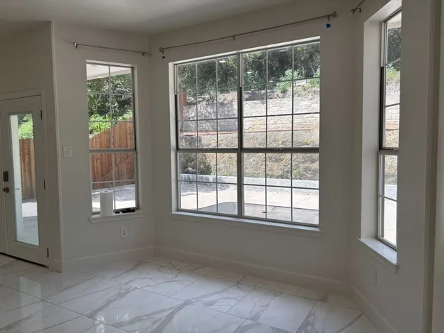 an empty room with windows