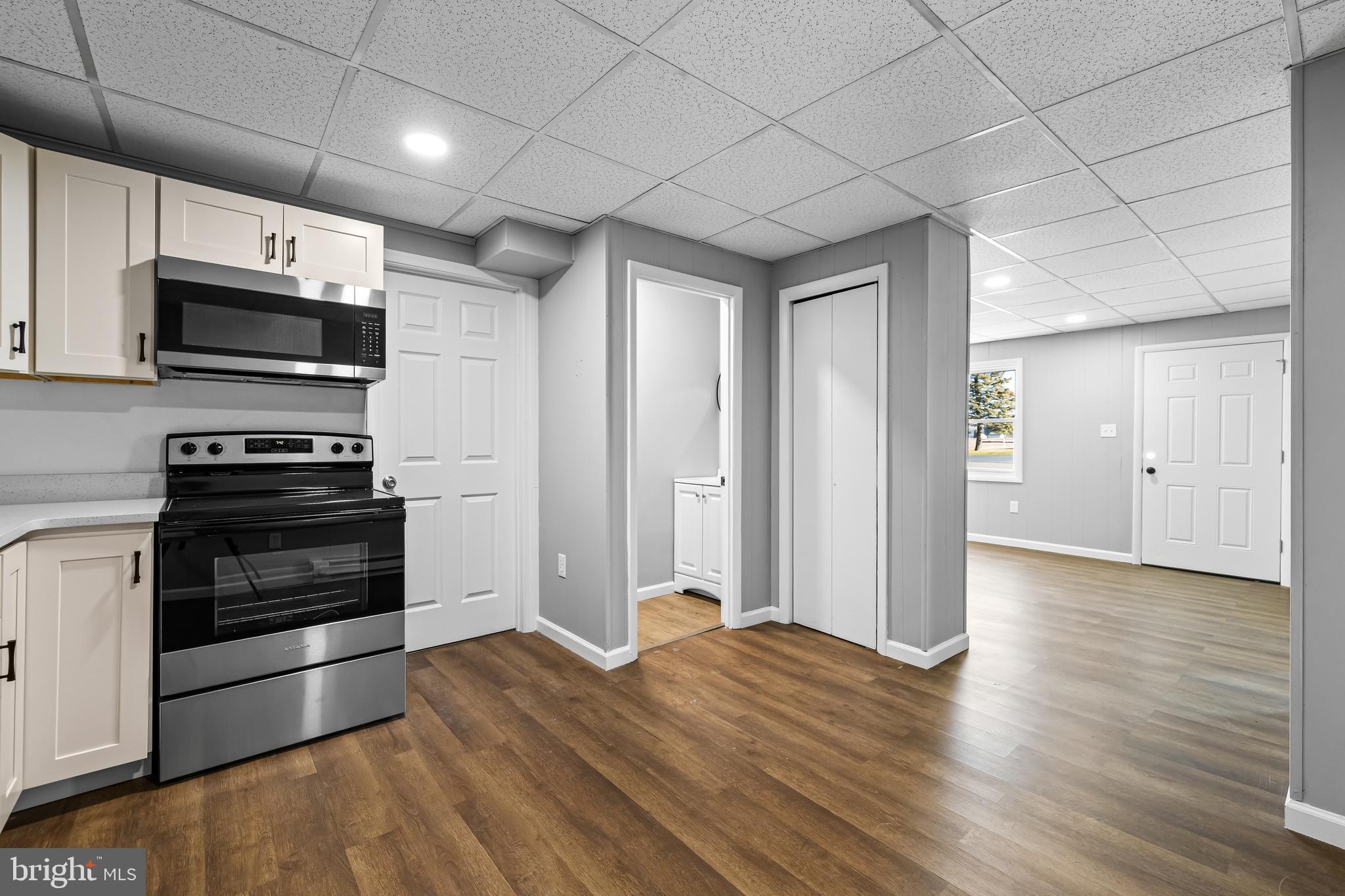 1480 Seven Valleys Road, Unit 3 York, PA 17408 - Photo 5 of 17 a kitchen with stainless steel appliances kitchen island granite countertop a stove and a refrigerator