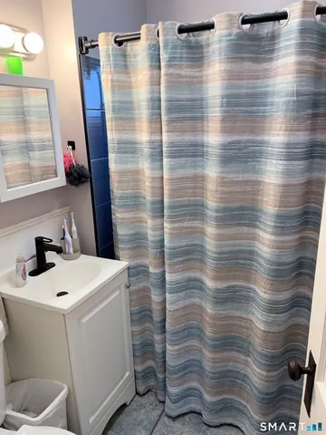 a bathroom with a sink and a shower
